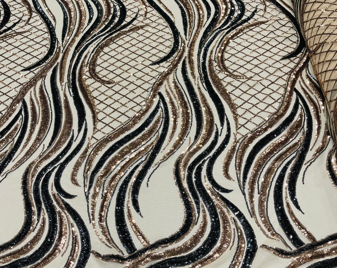 Gold/Black sequin flame design on a 4 way stretch nude mesh-sold by the yard.