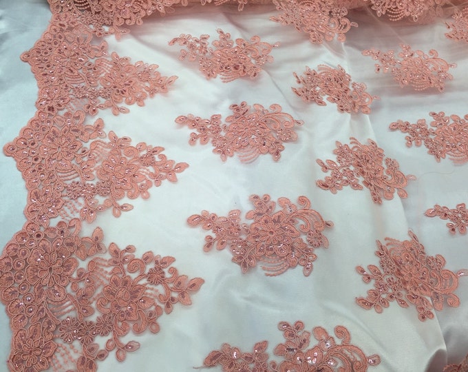 Coral flower lace corded and embroider with sequins on a mesh. Wedding/bridal/prom/nightgown fabric. Sold by the yard.