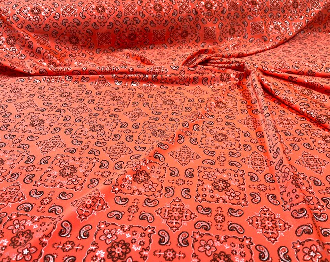 Neon Orange metallic bandanna print on a stretch tricot spandex fabric- Sold by the yard.