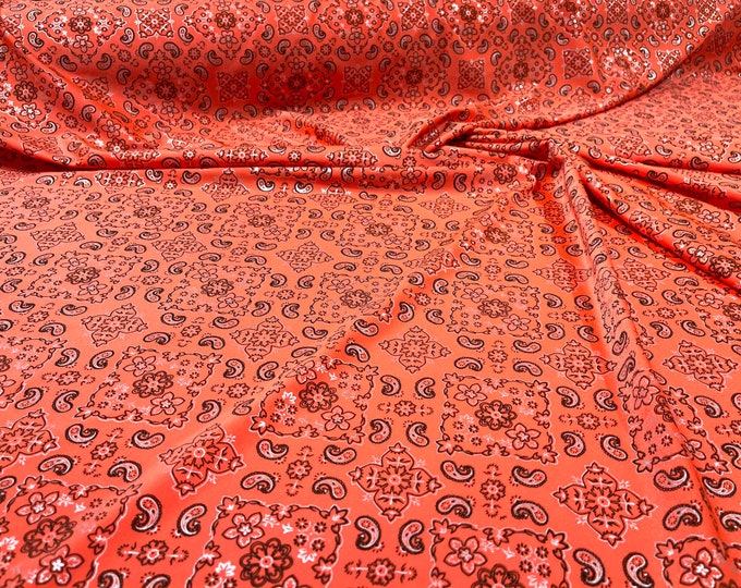 Neon Orange metallic bandanna print on a stretch tricot spandex fabric- Sold by the yard.