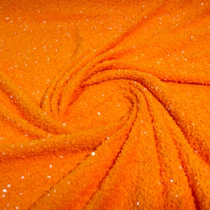 Bright Orange 5mm sequins on a light orange stretch velvet 2-way stretch, sold by the yard.