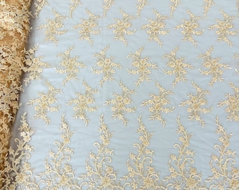 Blush flowers embroider with sequins and heavy beaded on a mesh lace fabric-sold by the yard.