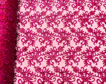 Fuchsia corded flowers embroider with sequins on a mesh lace fabric-sold by the yard-