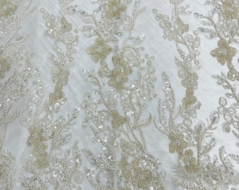Ivory metallic floral embroider and heavy beaded on a mesh lace fabric-sold by the yard-