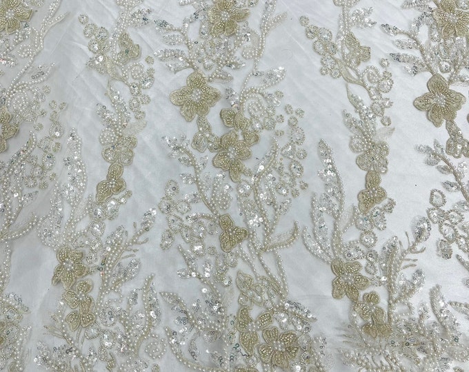 Ivory metallic floral embroider and heavy beaded on a mesh lace fabric-sold by the yard-