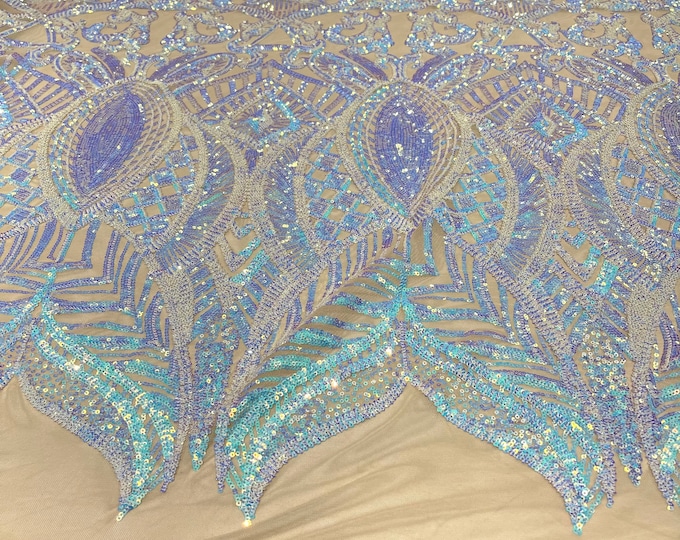 Aqua clear iridescent royalty sequin design on a nude 4 way stretch mesh-prom-sold by the yard.