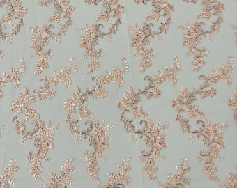 Blush peach flower lace corded and embroider with sequins on a mesh-Sold by the yard.
