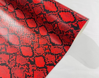 Piel sintética de vinilo con estampado de serpiente, rojo/negro, tela de PVC texturizada de 54" de ancho, cortada a medida.
