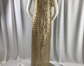 Geometric designer matt gold sequins embroider on a nude mesh fabric-54" wide-sold by the yard.