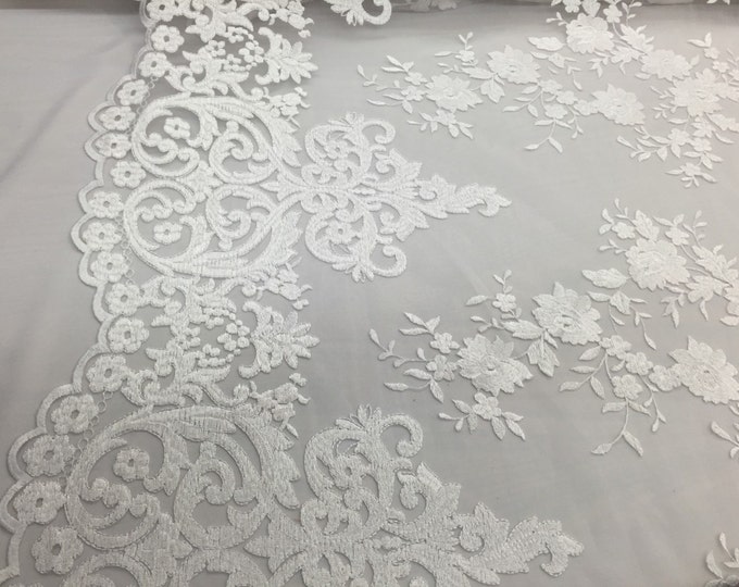 White flowers embroider on a 2 way stretch mesh lace. Wedding/Bridal/Prom/Nightgown fabric-apparel-fashion-dresses-Sold by the yard.
