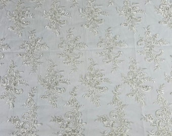 Ivory Lex floral design corded and embroider with sequins on a mesh lace fabric-prom-sold by the yard.