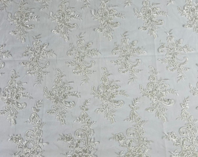 Ivory Lex floral design corded and embroider with sequins on a mesh lace fabric-prom-sold by the yard.