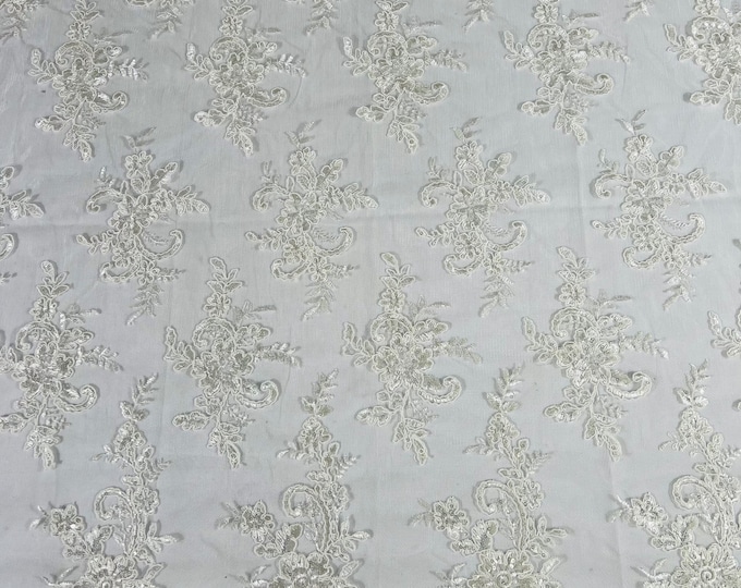 Ivory Lex floral design corded and embroider with sequins on a mesh lace fabric-prom-sold by the yard.