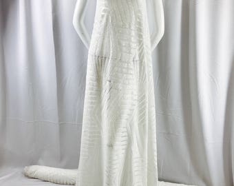 Off White geometric design embroidory with sequins on a white mesh-dresses-fashion-apparel-nightgown-decorations-sold by the yard.