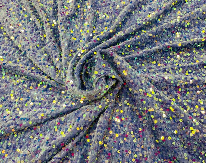 Clear Iridescent economic all over shiny sequins on a 2 way stretch Lavender velvet , sold by the yard.