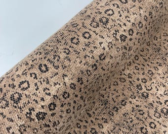 Tan/Black python snake print on a cotton canvas/58” wide/sold by the yard.