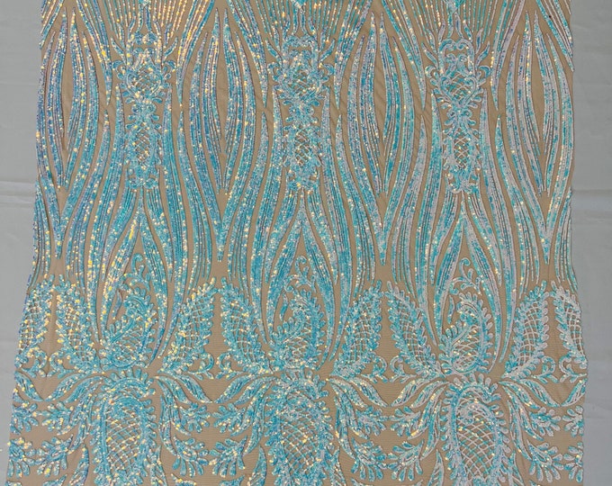 Aqua iridescent Paisley sequin design on a nude 4 way stretch mesh-prom-sold by the yard.