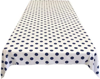 May include: White tablecloth with a navy blue polka dot pattern.
