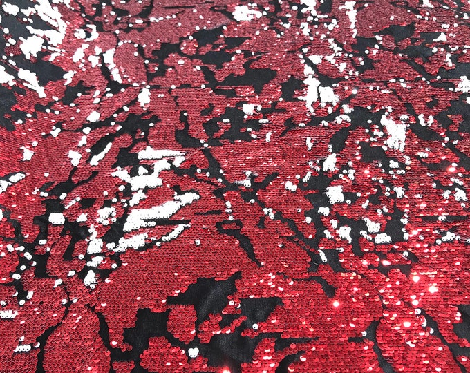 Red/White sequins flip two tone camouflage  design on a black stretch velvet, Sold by the yard.