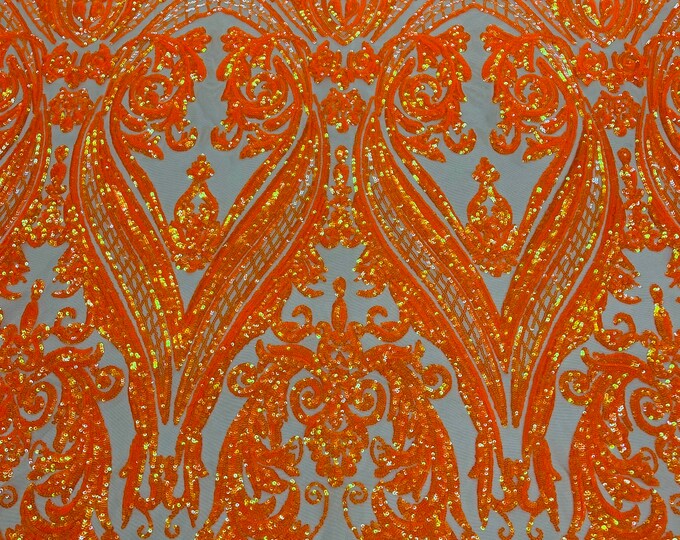 Neon orange iridescent shiny sequin damask design on a Nude 4 way stretch mesh-sold by the yard.