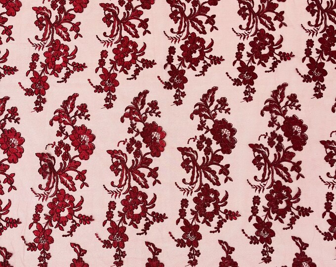 Burgundy floral design embroider and corded on a mesh lace fabric-sold by the yard.