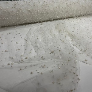 Ivory Heavy Scattered Pearls Studded Mesh, 2-Way Stretch, sold by the yard.