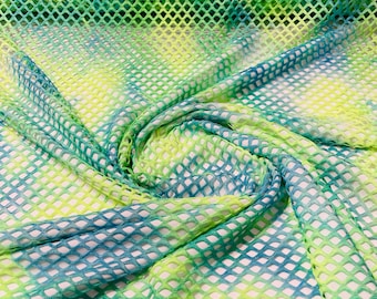 Green/Blue big fishnet diamond mesh tie dye with silver glitter 4 way stretch 58/60 inches wide. Sold by the yard.