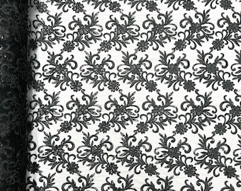 Black corded flowers embroider with sequins on a mesh lace fabric-sold by the yard-