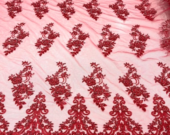 Red elegant hand beaded flower design embroider on a mesh lace-prom-sold by the yard.