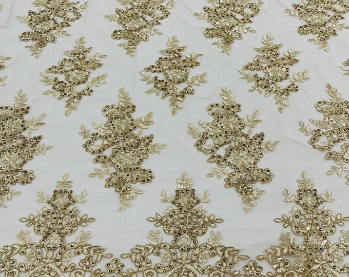 Champagne corded flowers embroider with sequins on a mesh lace fabric-sold by the yard.