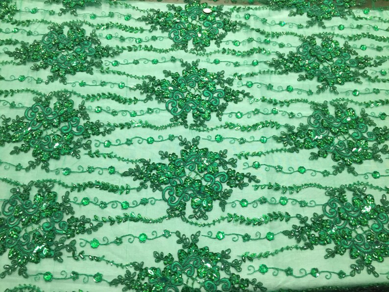 yard Green magnificent design embroider and heavy beaded on a mesh lace
