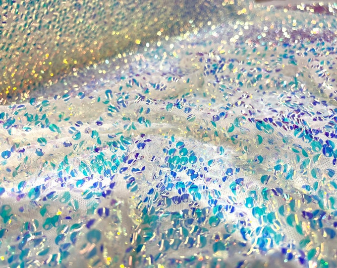 Aqua Clear iridescent mini round paillette sequins embroidered on a white stretch mesh, sold by the yard.