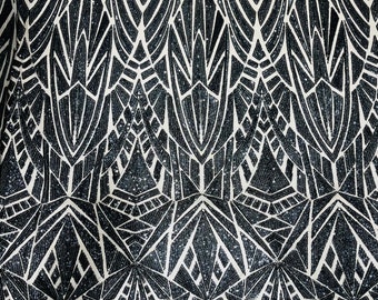 Black Geometric shiny sequin design on a Nude 4 way stretch mesh-sold by the yard.