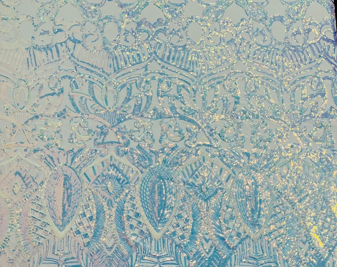 Aqua clear iridescent royalty sequin design on a white 4 way stretch mesh-prom-sold by the yard.