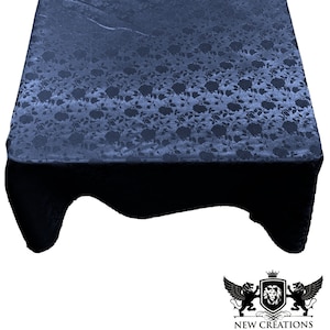 May include: A dark blue tablecloth with a floral pattern. The tablecloth is made of a soft, silky fabric and has a subtle sheen.