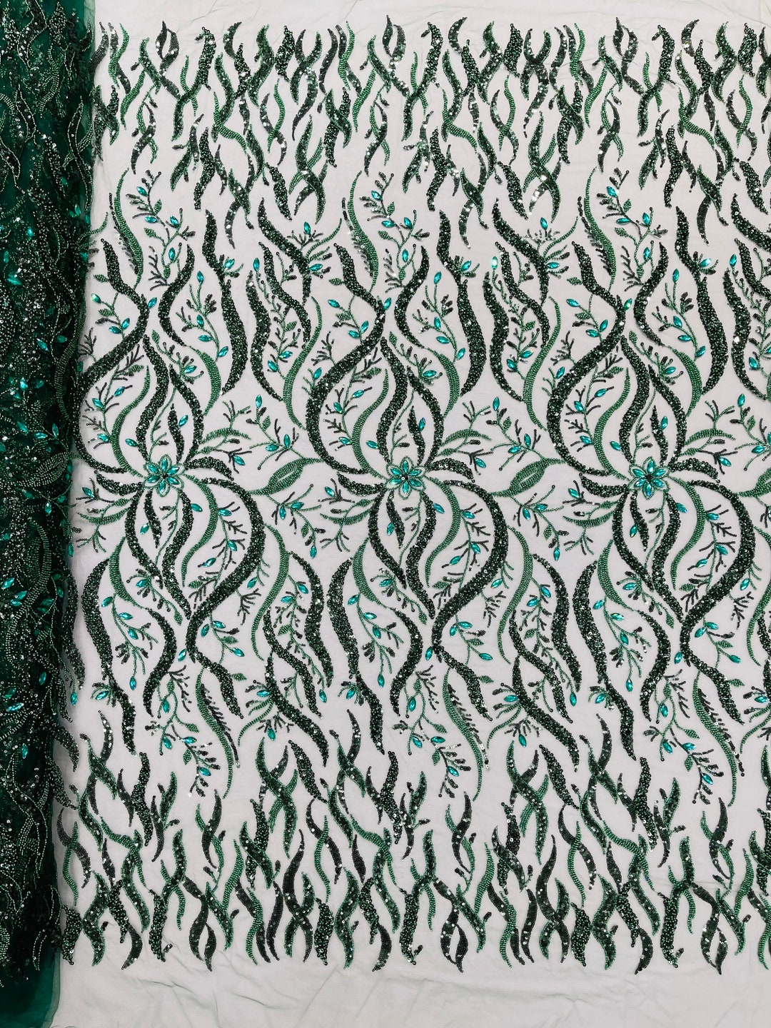 Off white Vine Design Embroider and heavy beading on a mesh lace-sold by the yard.