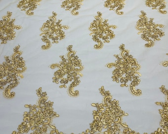 Metallic Gold flower lace corded and embroider with sequins on a mesh-Sold by the yard.