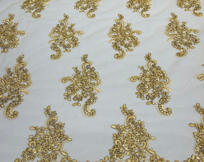 Metallic Gold flower lace corded and embroider with sequins on a mesh-Sold by the yard.