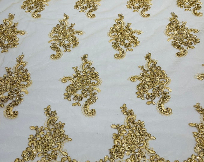 Metallic Gold flower lace corded and embroider with sequins on a mesh-Sold by the yard.