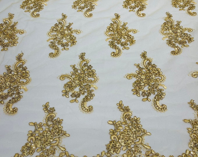 Metallic Gold flower lace corded and embroider with sequins on a mesh-Sold by the yard.