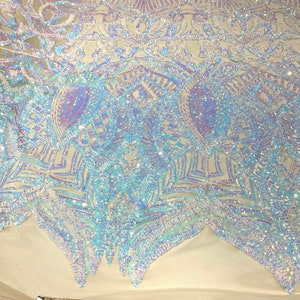 Aqua clear iridescent royalty sequin design on a champagne 4 way stretch mesh-prom-sold by the yard.