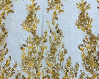 Gold metallic floral embroider and heavy beaded on a mesh lace fabric-sold by the yard-