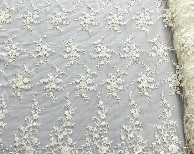 Ivory flower embroider with sequins and heavy beaded on a mesh lace fabric-sold by the yard.