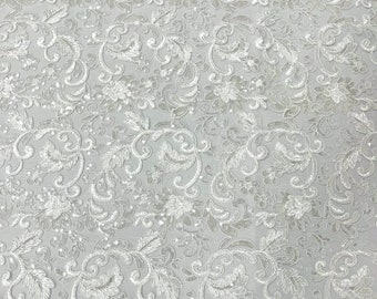 White corded embroider flowers with sequins on a mesh lace fabric-prom-sold by the yard.