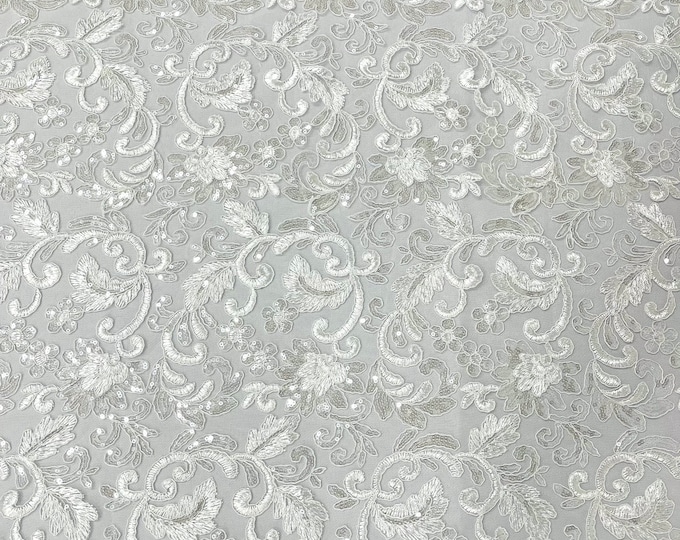 White corded embroider flowers with sequins on a mesh lace fabric-prom-sold by the yard.