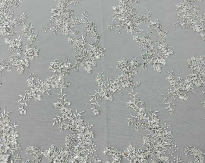 Ivory flower lace corded and embroider with sequins on a mesh-Sold by the yard.