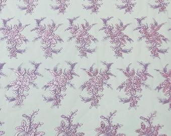 Lilac corded embroider with sequins on a mesh lace fabric-prom-sold by the yard.