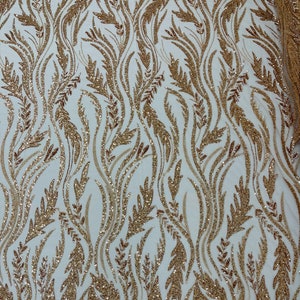 Festival Design Embroider and heavy beading on a mesh lace-sold by the yard. Silver/Clear