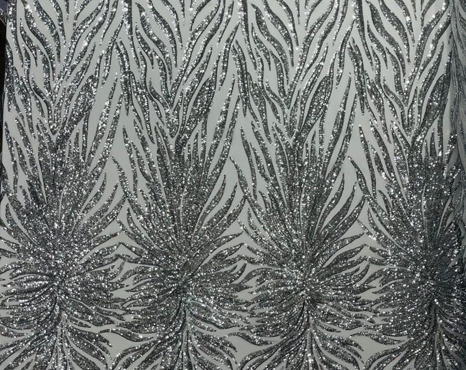 Silver - Phoenix feather design with sequins embroider on a white 4 way stretch mesh fabric-sold by the yard.