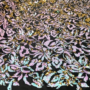 Aqua blue, gold iridescent sequins flip two tone floral design on a black stretch velvet, Sold by the yard.